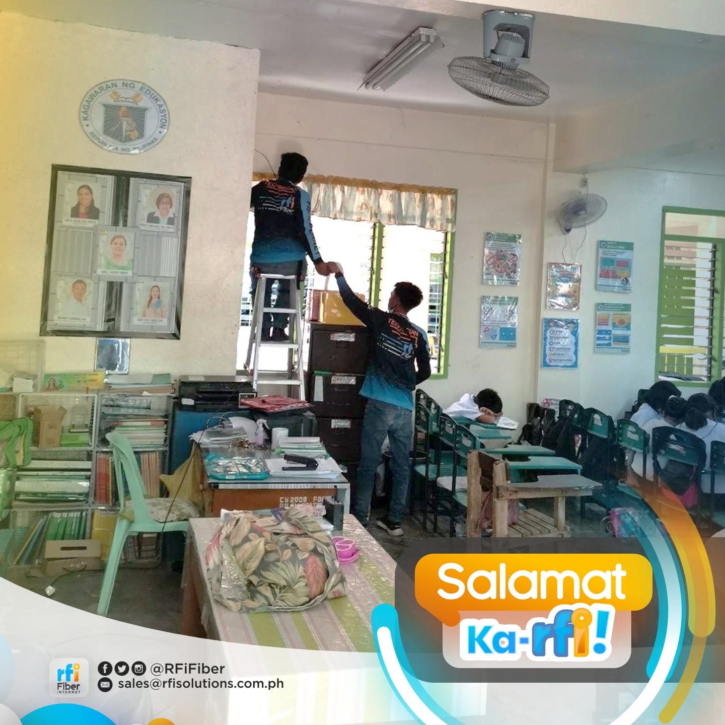RFi Fiber technicians installing internet cable at a school office
